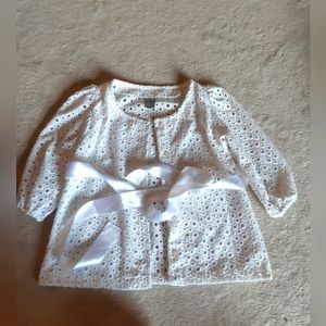 White button-up vest